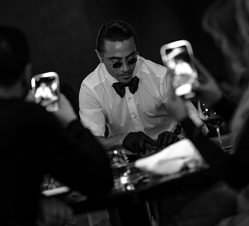 Nusret Gokce serving guests during a live restaurant moment